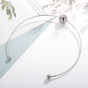 Detail of punk hollow ball choker in silver stainless steel with adjustable open neck ring