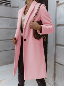 Detail of pink wool blend coat featuring classic lapels and a single black button closure
