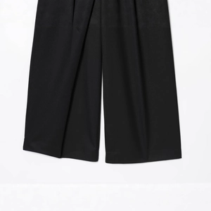 Women's chic black wrap-front wide leg trousers in a premium woven fabric with elegant drape
