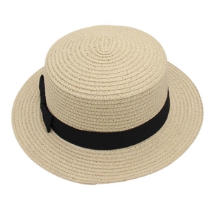 Close-up of beige boater hat with black ribbon detail and woven straw texture