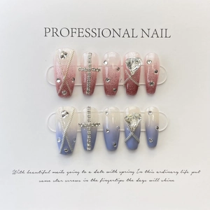 Handmade press-on nail kit with red blue gradient, rhinestones and metal chain decor