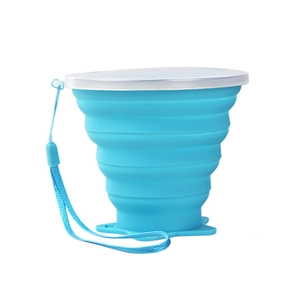 Blue portable folding silicone cup with star pattern, lid and lanyard on white background