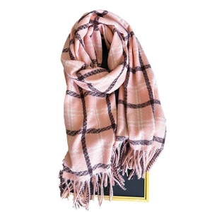 Pink and white checkered cashmere-like winter scarf with fringe details on white background