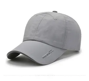 Detail view of a light gray quick-dry sports cap with SPORTS embroidery and breathable fabric