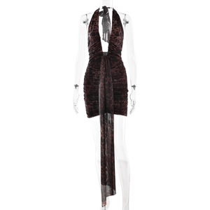 Halter neck leopard print mini dress with deep V-neck and front tie detail on mannequin