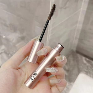 Rose gold Rita mascara with a brown brush for lengthening and curling lashes