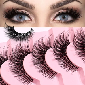 Dramatic fox-eye false eyelashes with clear band for a natural long-winged lash look