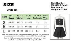 Detailed size guide table for women's two-piece strapless crop top and pleated skirt set