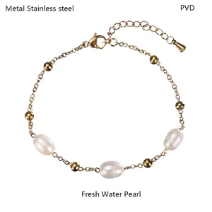 Detail of PVD vacuum plated stainless steel gold chain featuring natural freshwater pearls