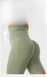 Detail of high-waisted olive green fitness shorts with seamless butt lifting design