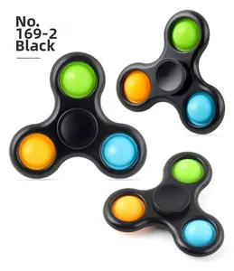 Three-finger black fidget spinner with green orange and blue pop it silicone bubbles