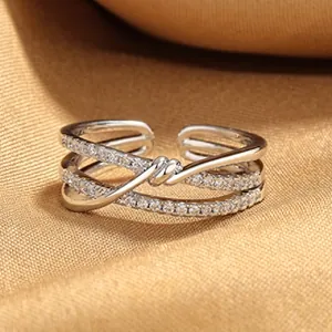 Elegant S925 sterling silver criss-cross open ring with shimmering cubic zirconia inlay