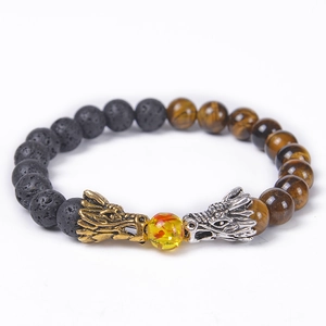 Detail of beaded bracelet with dragon heads, volcanic lava stones and tiger eye beads