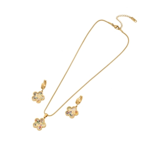 Golden jewelry set with flower pendants featuring colorful stones on a white background