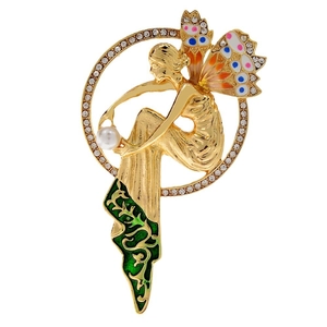 Vintage gold fairy brooch with colorful enamel wings and pearl detail on white background