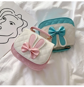 Detail of cute girls handbags with bunny ears, bowknot and quilted faux leather design