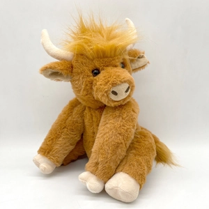 Cute realistic brown highland cow plush toy with long hair on a clean white background