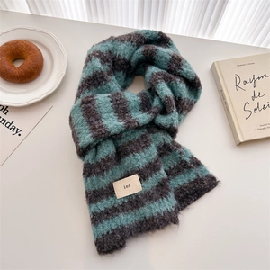 Close-up of blue and gray striped knit scarf with wool texture and ins style label