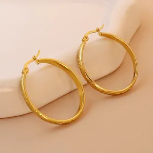 18K gold plated stainless steel hoop earrings with textured dragon scale wave patterns
