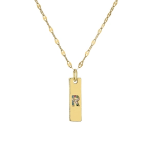 Macro shot of gold plated pendant with colorful crystals forming the letter R on a chain