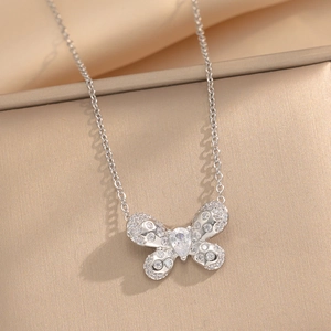Elegant silver butterfly necklace with zircon stones in a silk-lined jewelry gift box