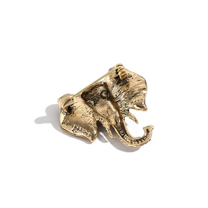 Vintage gold elephant brooch with crystal rhinestones showing the secure back pin closure