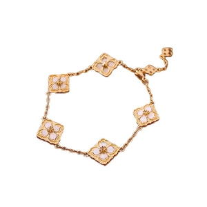 14K gold plated bracelet featuring five diamond-shaped floral charms with white mother of pearl