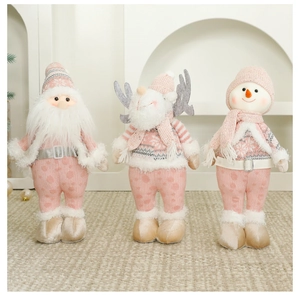Poupées de Noël roses et blanches avec renne, père Noël et bonhomme de neige en peluche