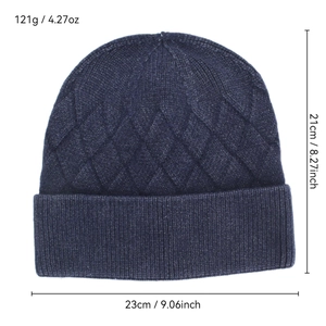 Thick navy blue knitted beanie hat with classic diamond pattern and ribbed cuff design