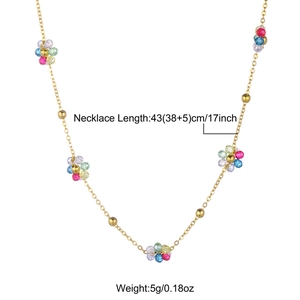 Detail view of gold necklace with colorful daisy bead clusters and sizing specifications