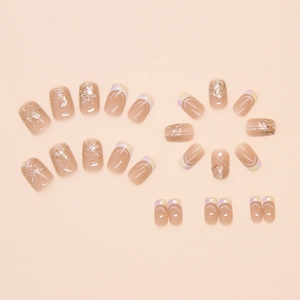 Macro detail of nude pink press-on nails with silver glitter and iridescent French lines
