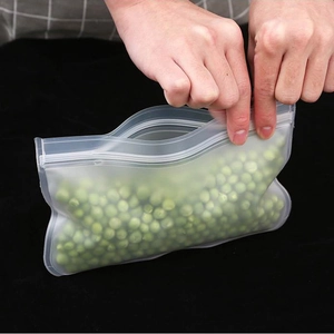 Thick frosted resealable food storage bag for freezing being closed by hands