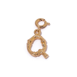 Gold plated bamboo texture letter Q pendant with spring clasp on white background