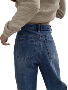 Women's loose patchwork denim jeans in dark blue shown from a back view fit perspective