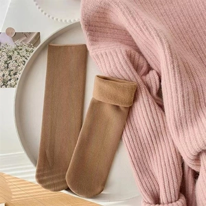 Close-up of caramel thick winter socks showing soft thermal fleece lining and ribbed texture
