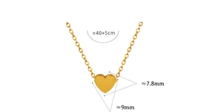 Macro view of gold heart pendant with dimensions showing polished 18K steel necklace