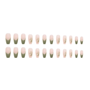 Detail of floral press-on nails with 3D pearls and green French tips in a 24-piece set