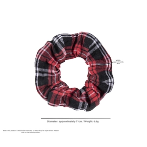 Detail view of red and black plaid scrunchie showing 11cm diameter and 4cm width dimensions