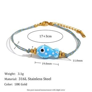 Braided rope bracelet with blue ceramic fish charm and 18K gold plated stainless steel