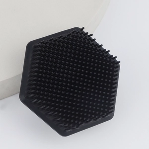 Macro detail of hexagonal silicone face brush with soft bristles and matte finish