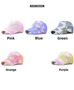 Matrix display of colorful tie-dye baseball caps featuring LOVE rhinestone embellishments