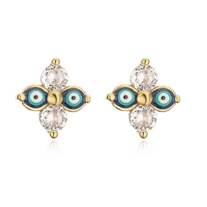 Detailed close-up of gold-plated cross earrings with zircon and blue enamel evil eye charms