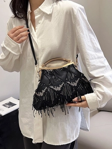 Elegant black sequin shell bag with fringe tassels and gold metal handle for women
