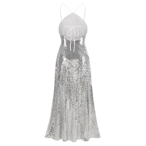 Detail view of the silver sequin backless halter dress showing fringe and lace-up design