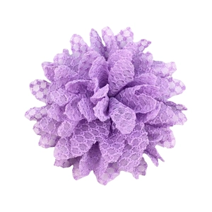 Detail of multi-layered purple lace sunflower hair accessory with honeycomb mesh texture