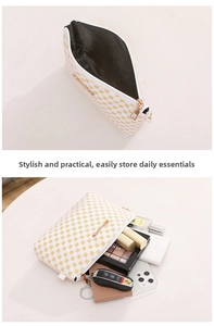 Detail of white PU leather bag with yellow geometric dots and gold zipper storage space