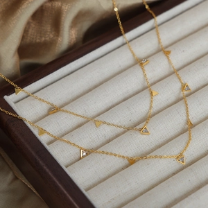 Elegant 18K gold plated titanium necklace with triangular diamond pendants on silk