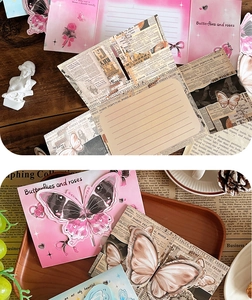 Macro shot of 3D butterfly greeting card set with vintage newspaper collage and envelopes