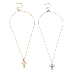 Cross pendant necklaces in gold and silver with intricate engravings and zircon stones