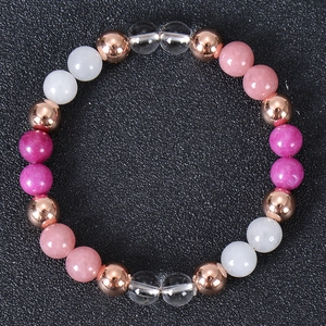 Detail of multi-color natural stone beads and rose gold accents on elastic bracelet